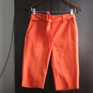 Preowned Orange Bermuda Classic Shorts.